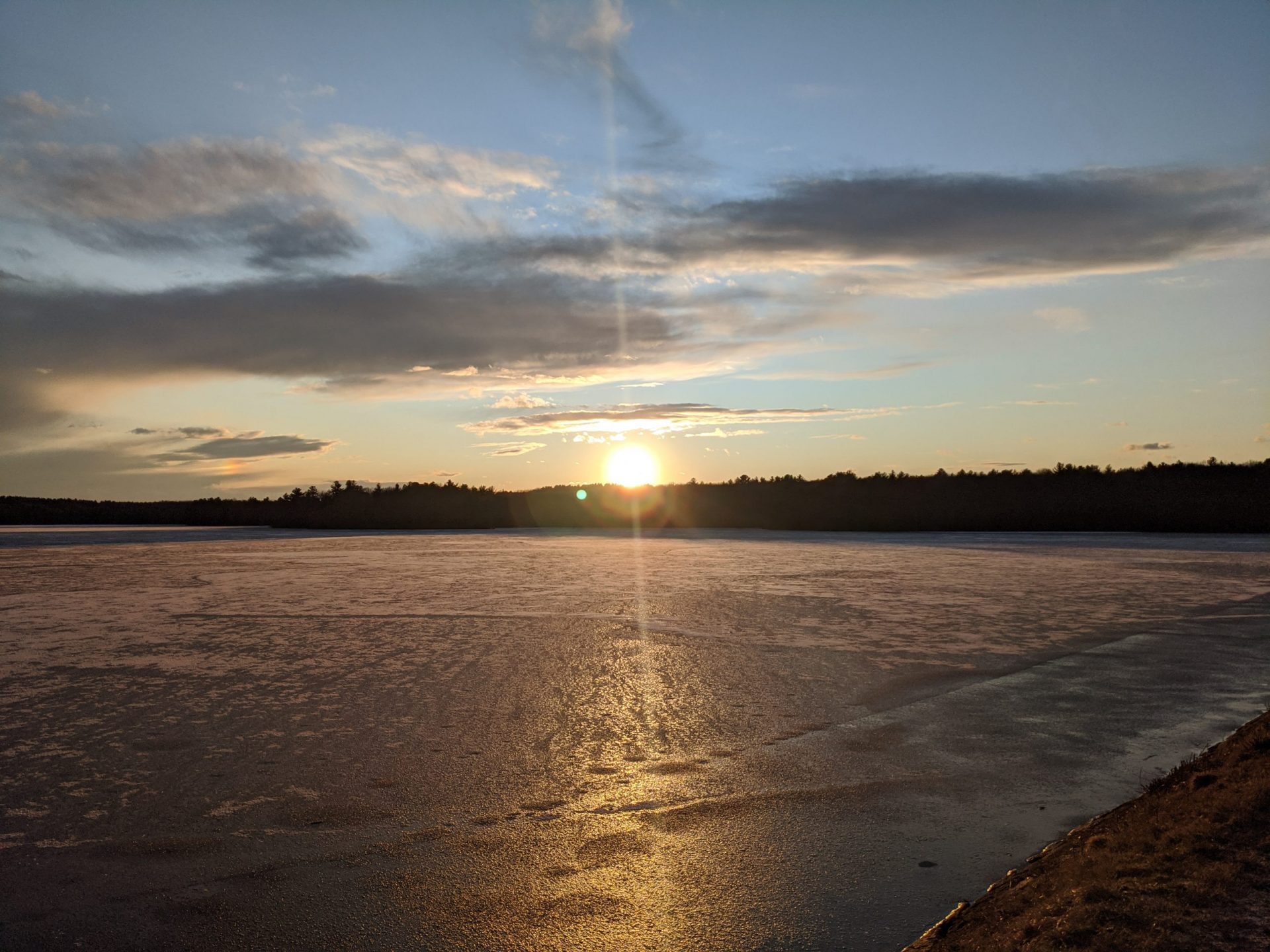 Sunset over ice-covered Ashland Reservoir January 2020